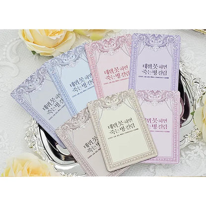 Debut Or Die Photocard Set featuring multiple pastel-colored ornate cards displayed on a silver tray
