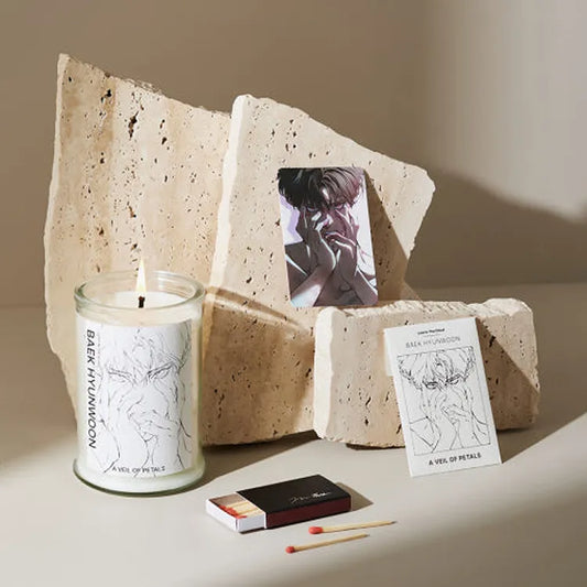 Lost in the Cloud Hyunwoon Cirrus Candle Set with illustrated glass candle and decorative cards on beige stone blocks