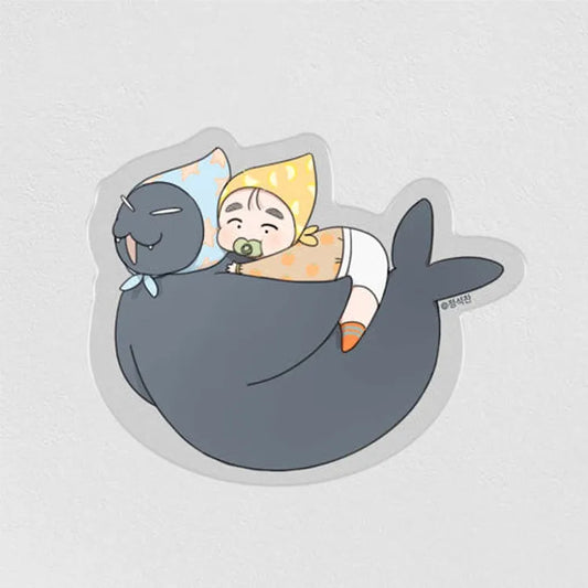 Our Sunny Days Baby Acrylic Block featuring a baby in yellow bonnet hugging a large gray seal cartoon