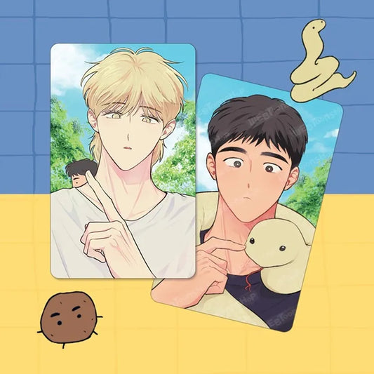 The Sacred Serpent's Seduction Card Tag featuring two illustrated male characters with detailed background